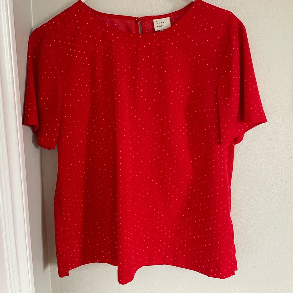 Medium red blouse with small white polka dots